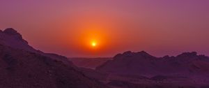 Preview wallpaper sunset, mountains, rocks, desert, sky