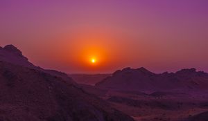 Preview wallpaper sunset, mountains, rocks, desert, sky