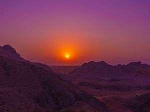 Preview wallpaper sunset, mountains, rocks, desert, sky
