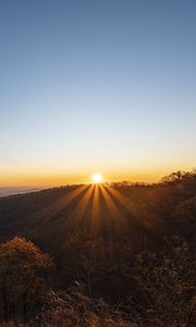 Preview wallpaper sunset, mountains, sun, rays, dusk