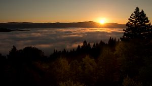 Preview wallpaper sunset, mountains, trees, clouds, dusk