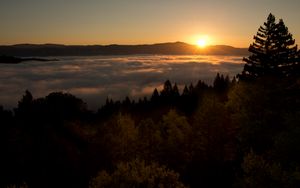 Preview wallpaper sunset, mountains, trees, clouds, dusk