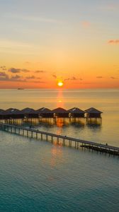 Preview wallpaper sunset, ocean, bungalow, sun, pier, beach vacation