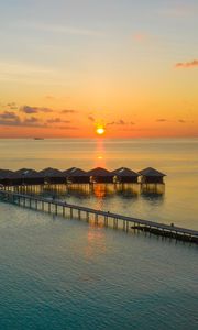 Preview wallpaper sunset, ocean, bungalow, sun, pier, beach vacation