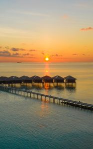 Preview wallpaper sunset, ocean, bungalow, sun, pier, beach vacation