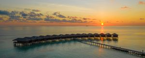 Preview wallpaper sunset, ocean, bungalow, sun, pier, beach vacation
