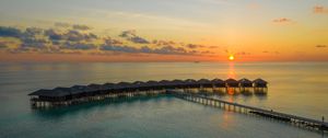 Preview wallpaper sunset, ocean, bungalow, sun, pier, beach vacation