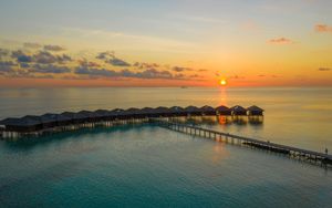 Preview wallpaper sunset, ocean, bungalow, sun, pier, beach vacation