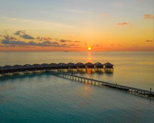 Preview wallpaper sunset, ocean, bungalow, sun, pier, beach vacation