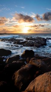 Preview wallpaper sunset, ocean, coast, stones, waves