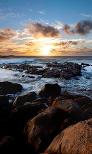 Preview wallpaper sunset, ocean, coast, stones, waves