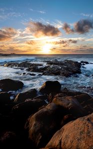 Preview wallpaper sunset, ocean, coast, stones, waves