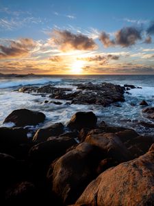 Preview wallpaper sunset, ocean, coast, stones, waves