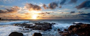 Preview wallpaper sunset, ocean, coast, stones, waves