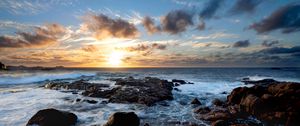 Preview wallpaper sunset, ocean, coast, stones, waves