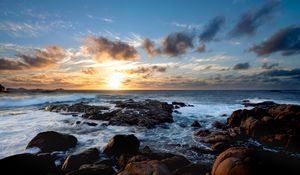 Preview wallpaper sunset, ocean, coast, stones, waves