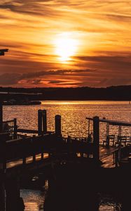 Preview wallpaper sunset, pier, river, evening, twilight