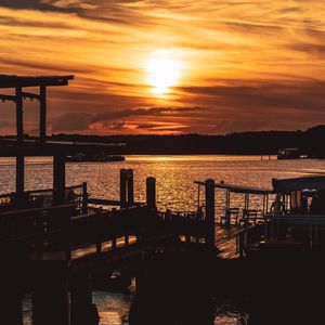 Preview wallpaper sunset, pier, river, evening, twilight