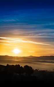 Preview wallpaper sunset, rays, hills, trees, sky