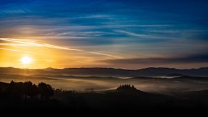Preview wallpaper sunset, rays, hills, trees, sky