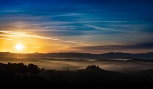 Preview wallpaper sunset, rays, hills, trees, sky