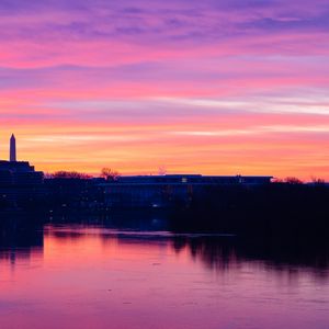 Preview wallpaper sunset, river, building, sky