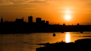 Preview wallpaper sunset, river, city, dusk, dark