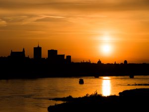 Preview wallpaper sunset, river, city, dusk, dark