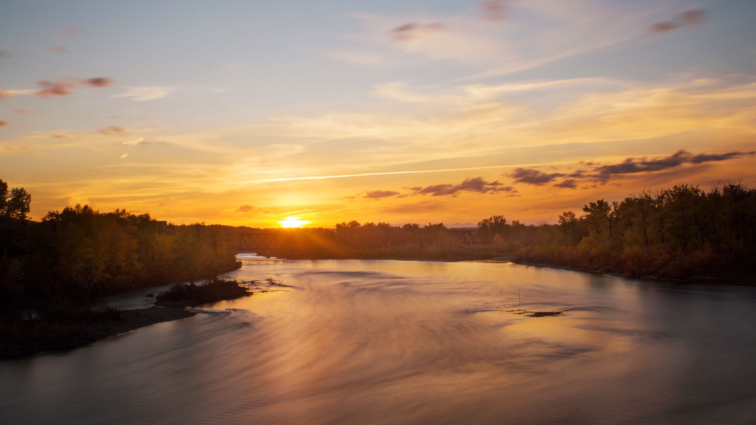 Download wallpaper 2560x1440 sunset, river, trees, sky widescreen 16:9