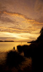 Preview wallpaper sunset, river, twilight, dark, shore