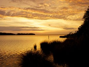 Preview wallpaper sunset, river, twilight, dark, shore