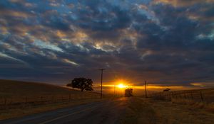 Preview wallpaper sunset, road, hills, sky