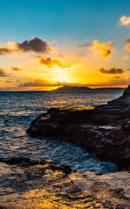 Preview wallpaper sunset, rocks, blocks, sun