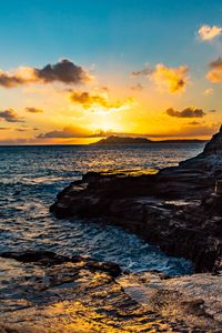 Preview wallpaper sunset, rocks, blocks, sun