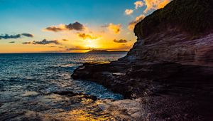 Preview wallpaper sunset, rocks, blocks, sun