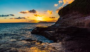 Preview wallpaper sunset, rocks, blocks, sun