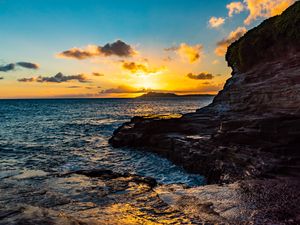 Preview wallpaper sunset, rocks, blocks, sun