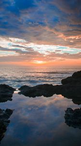 Preview wallpaper sunset, rocks, sea, clouds, stones