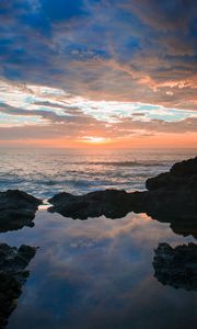 Preview wallpaper sunset, rocks, sea, clouds, stones