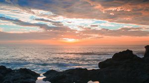 Preview wallpaper sunset, rocks, sea, clouds, stones