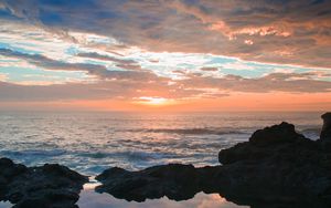 Preview wallpaper sunset, rocks, sea, clouds, stones