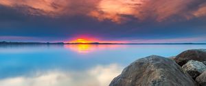 Preview wallpaper sunset, rocks, water, stones, landscape