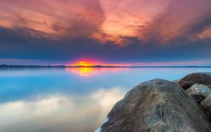 Preview wallpaper sunset, rocks, water, stones, landscape