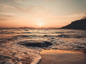 Preview wallpaper sunset, sea, beach, rocks, waves