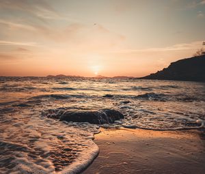 Preview wallpaper sunset, sea, beach, rocks, waves