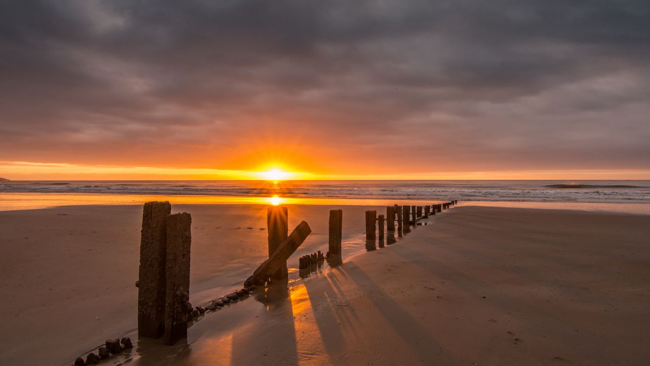 Wallpaper sunset, sea, beach, pillars, sand