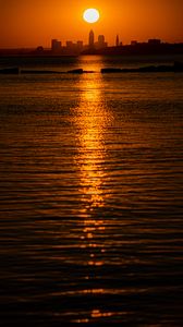 Preview wallpaper sunset, sea, city, dark, horizon