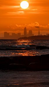 Preview wallpaper sunset, sea, city, dark, waves, horizon