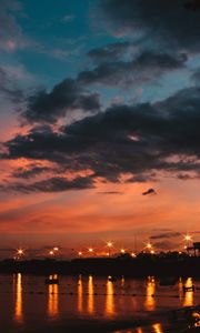 Preview wallpaper sunset, sea, lights, skyline, clouds, philippines