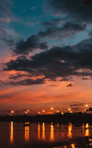 Preview wallpaper sunset, sea, lights, skyline, clouds, philippines